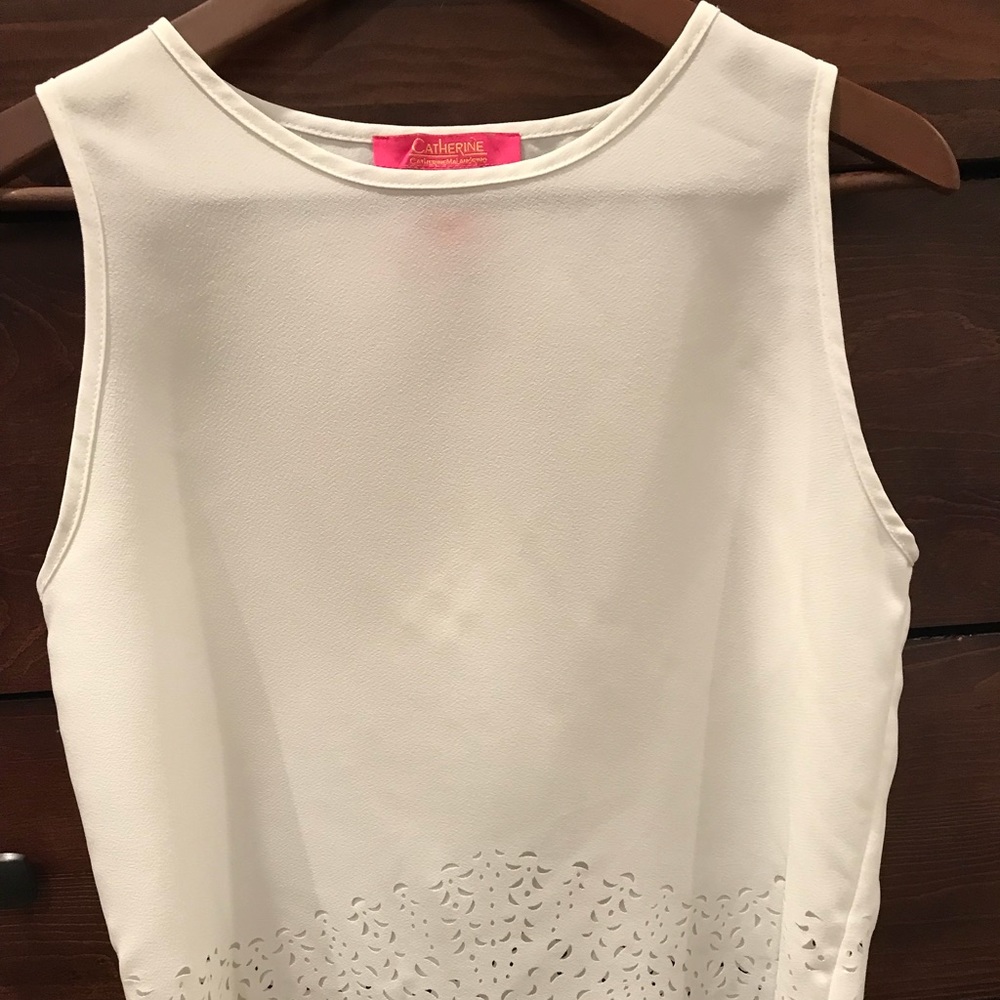 Beautiful white blouse with pattern cutout detail